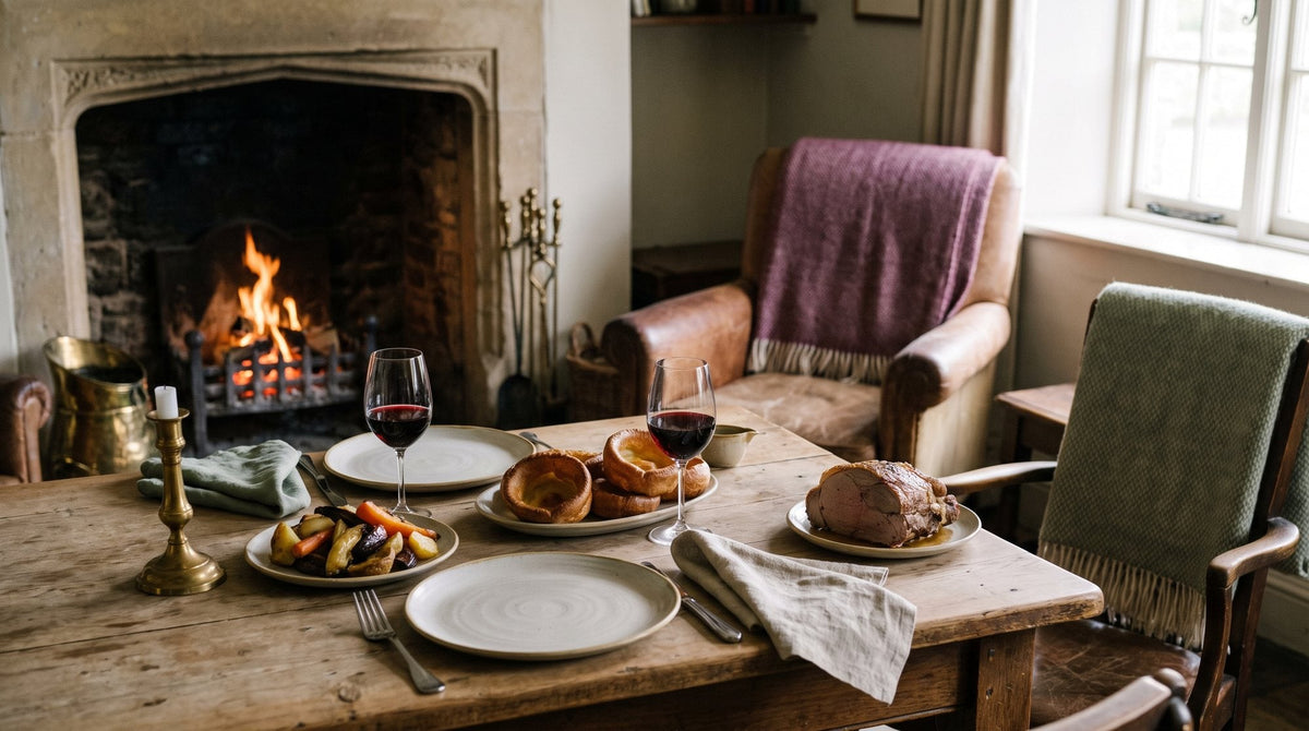 An old country pub interior with a crackling fireplace, wooden tables and a roast lunch set for two Image