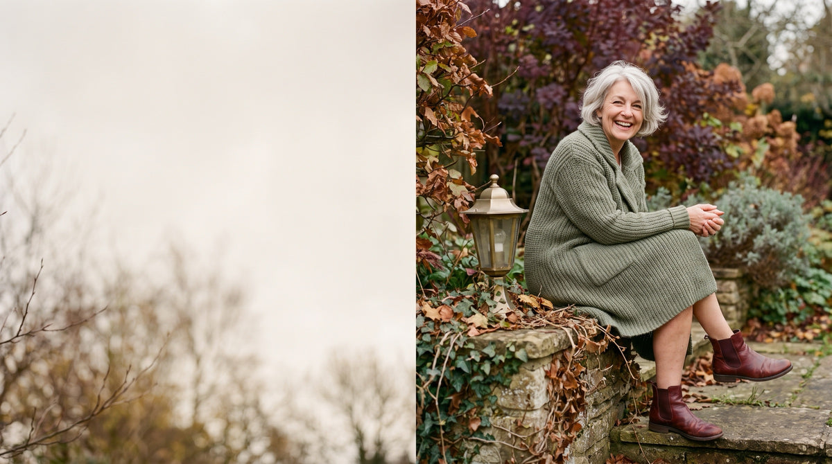 Woman in a sage knitted dress and burgundy ankle boots, smiling on garden steps in autumn