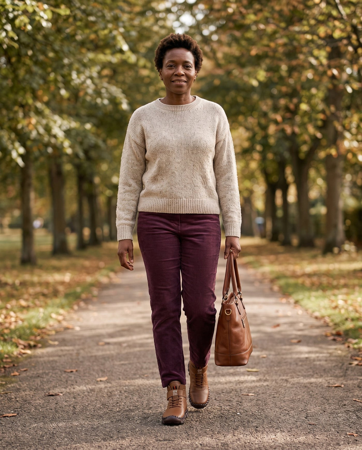 Grace wearing the brown lace-up ankle boots on an autumn walk Image