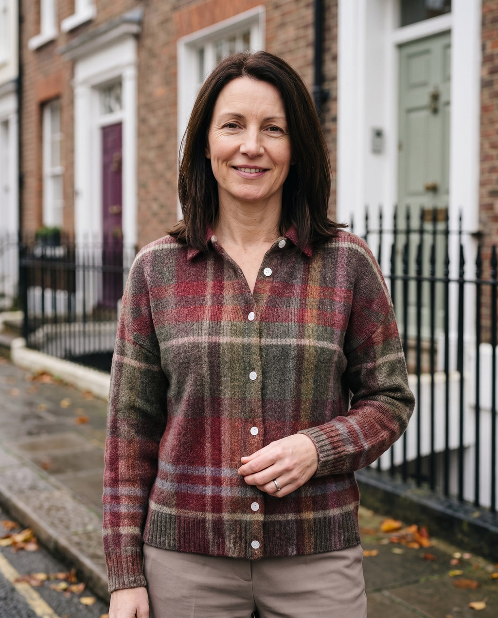 Woman wearing the checked knit blouse, close-up of the neckline and fabric