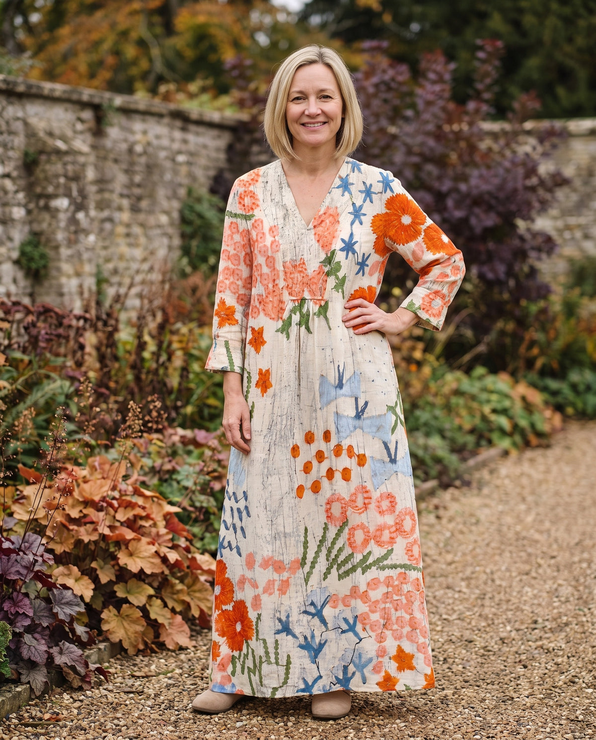 Woman wearing the comfortable dress in an autumn English garden Image