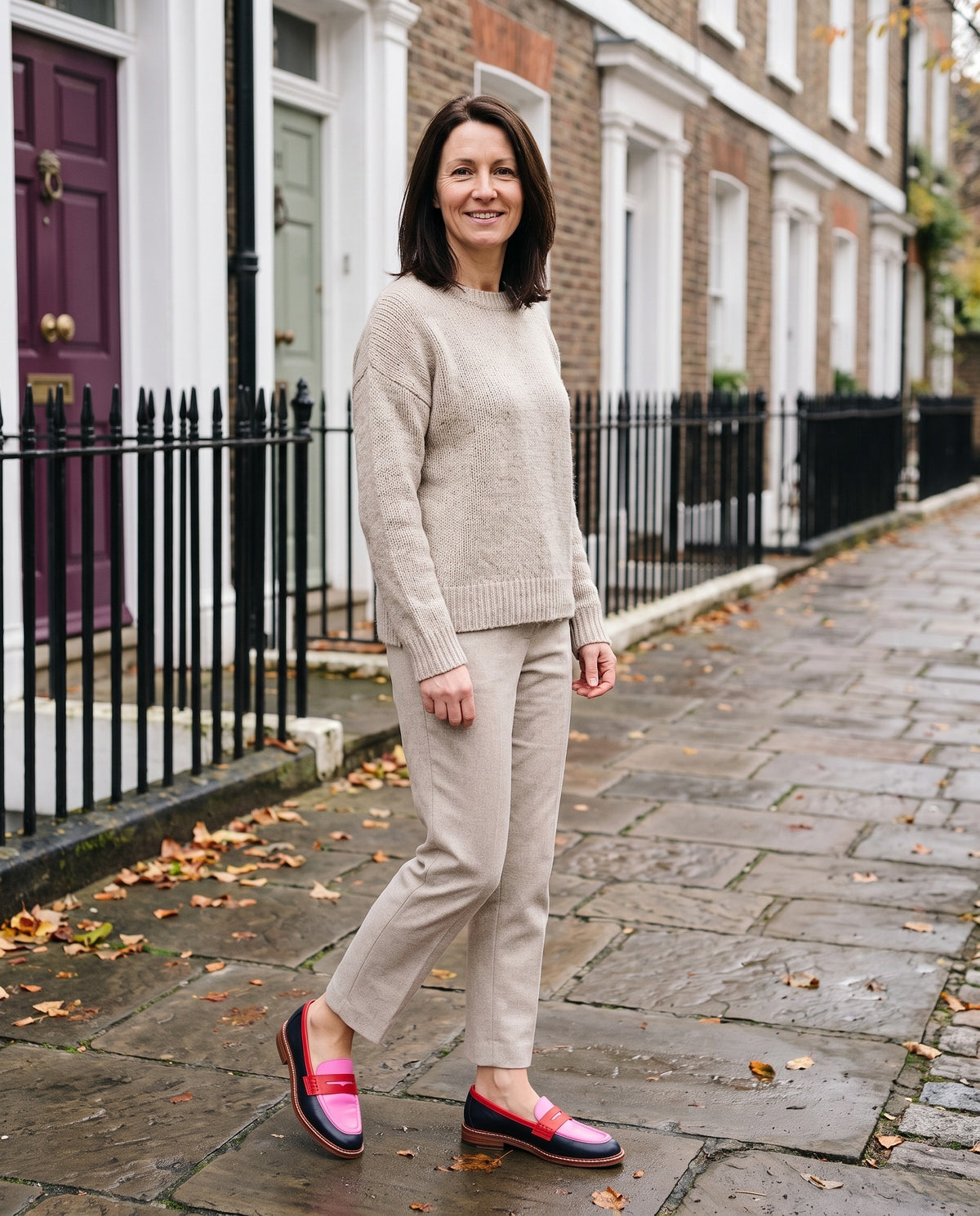 Woman wearing the elegant loafers on an English residential street