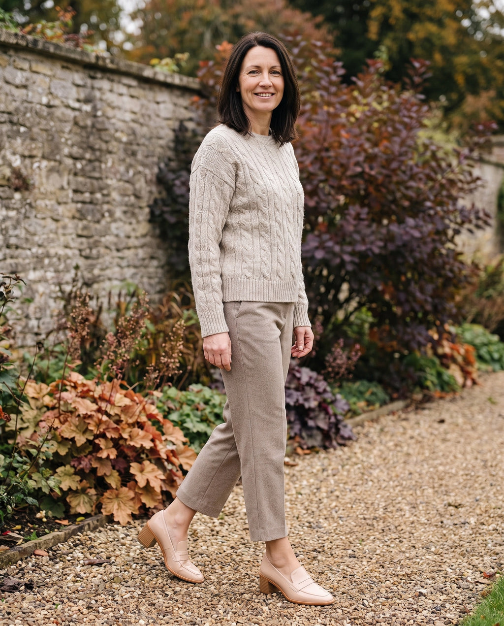 Woman wearing the orthopaedic loafers in an autumn English garden