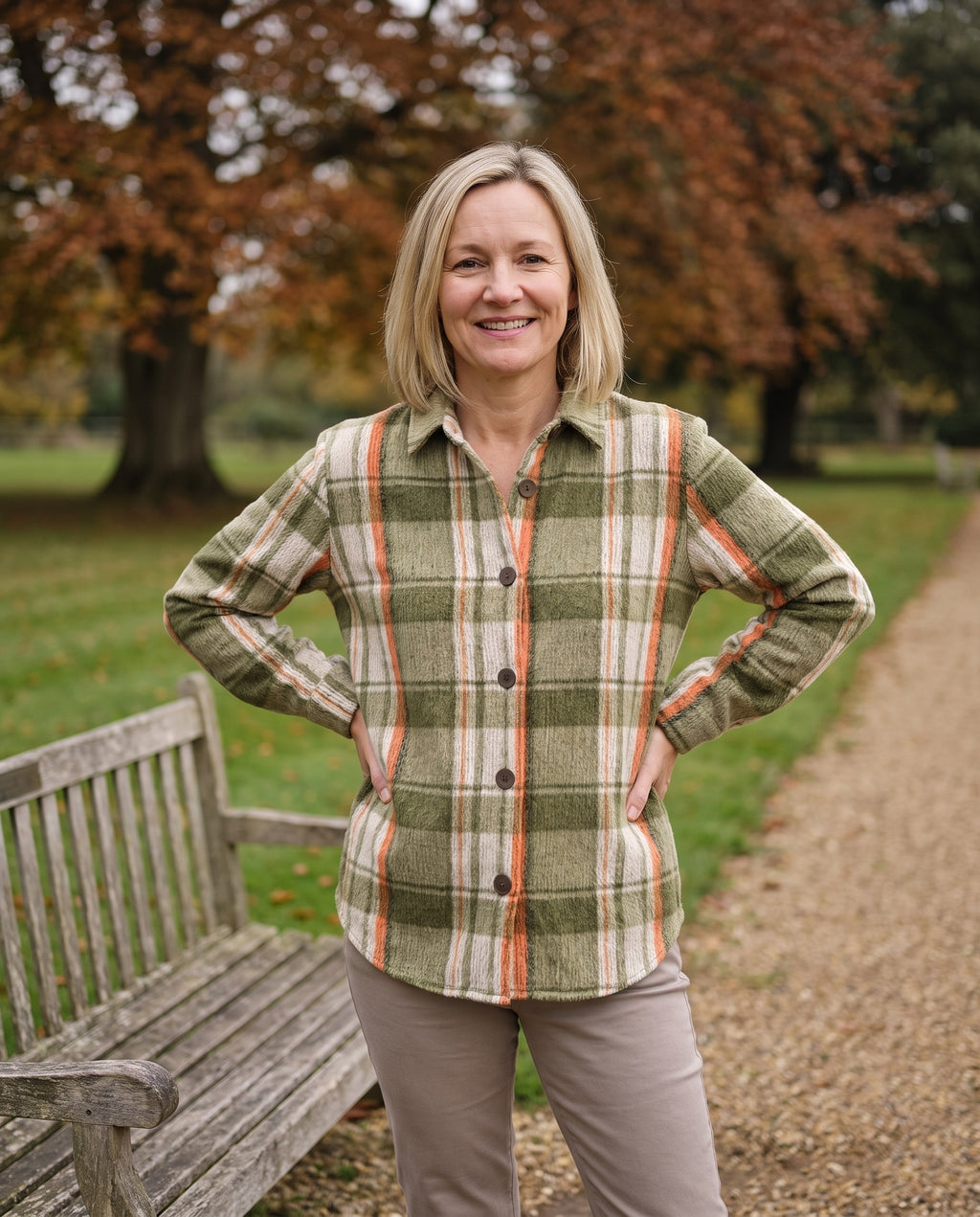 Woman wearing the checkered blouse in an English park in autumn