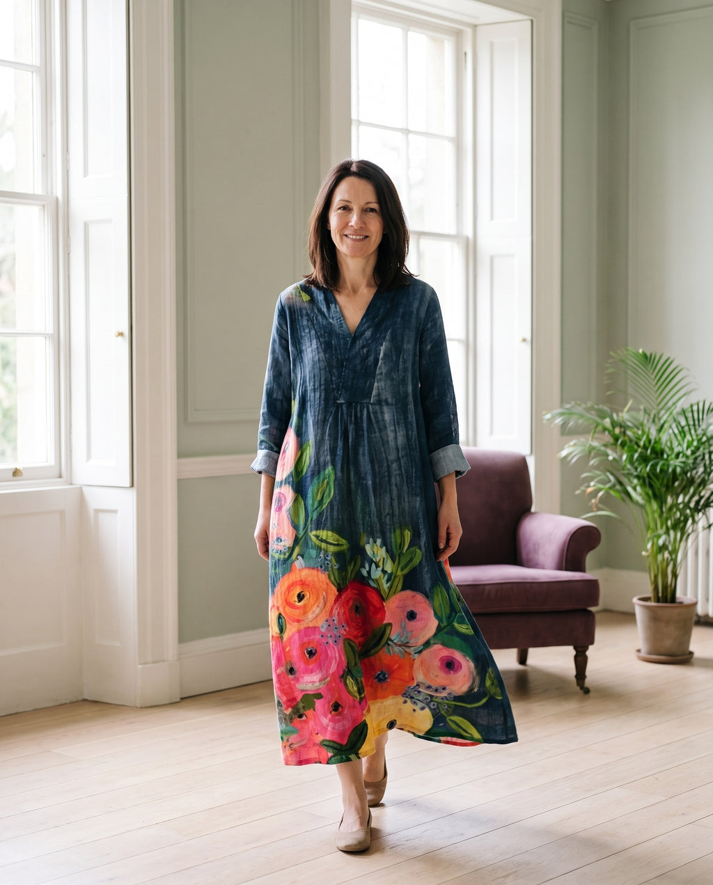 Woman wearing the elegant maxi dress in a bright Georgian interior