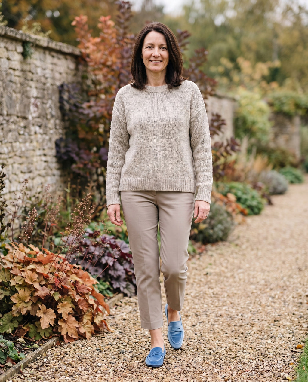 Woman wearing the sophisticated loafers in an autumn English garden