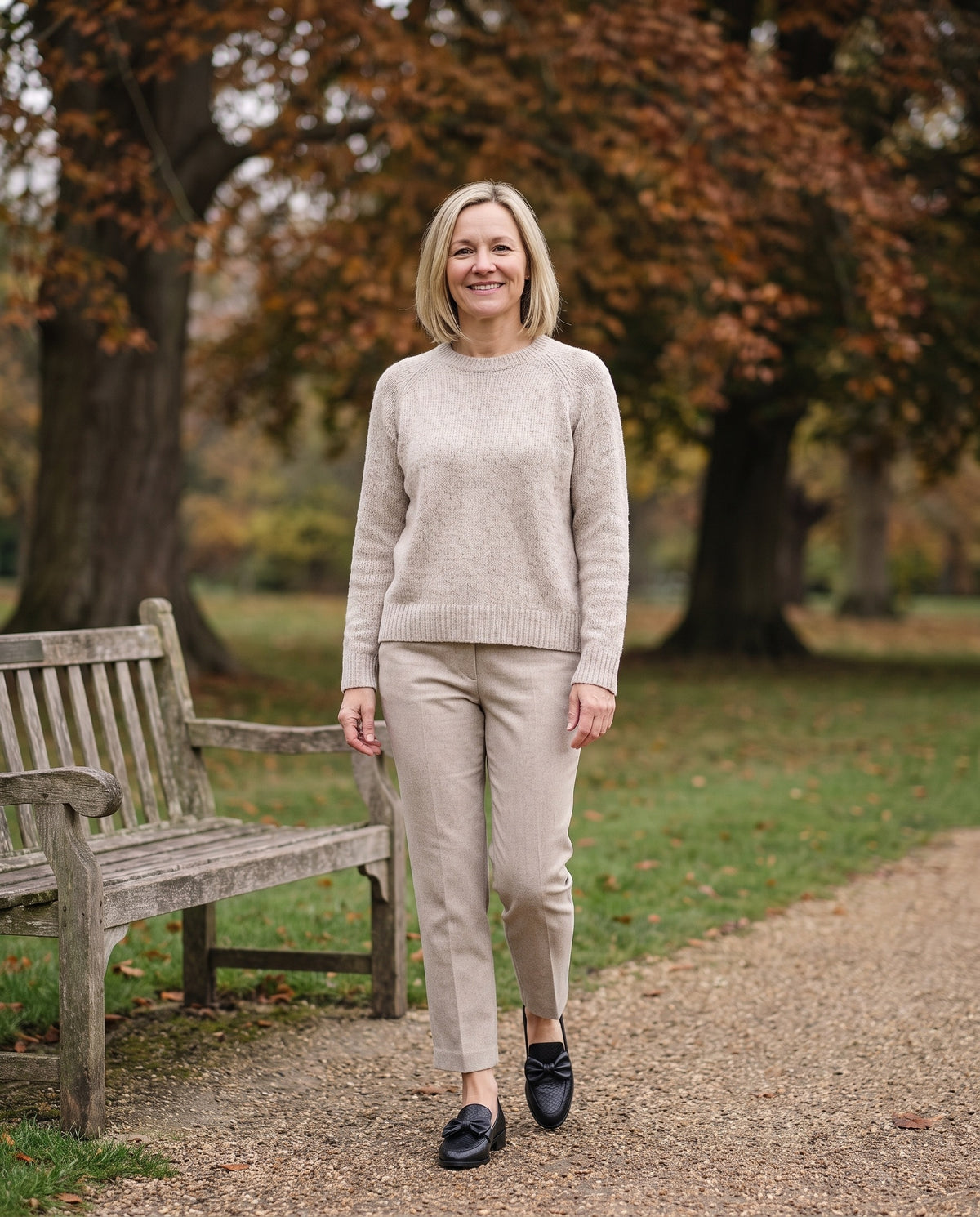 Woman wearing the luxe comfort loafers in an English park in autumn Image