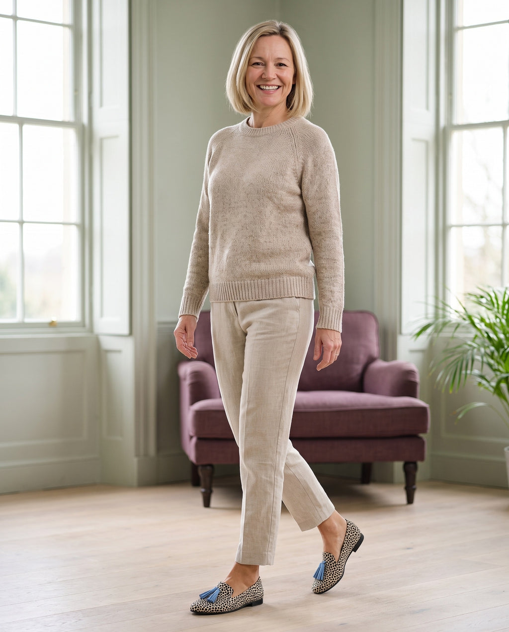 Woman wearing the refined comfort loafers in a bright Georgian interior