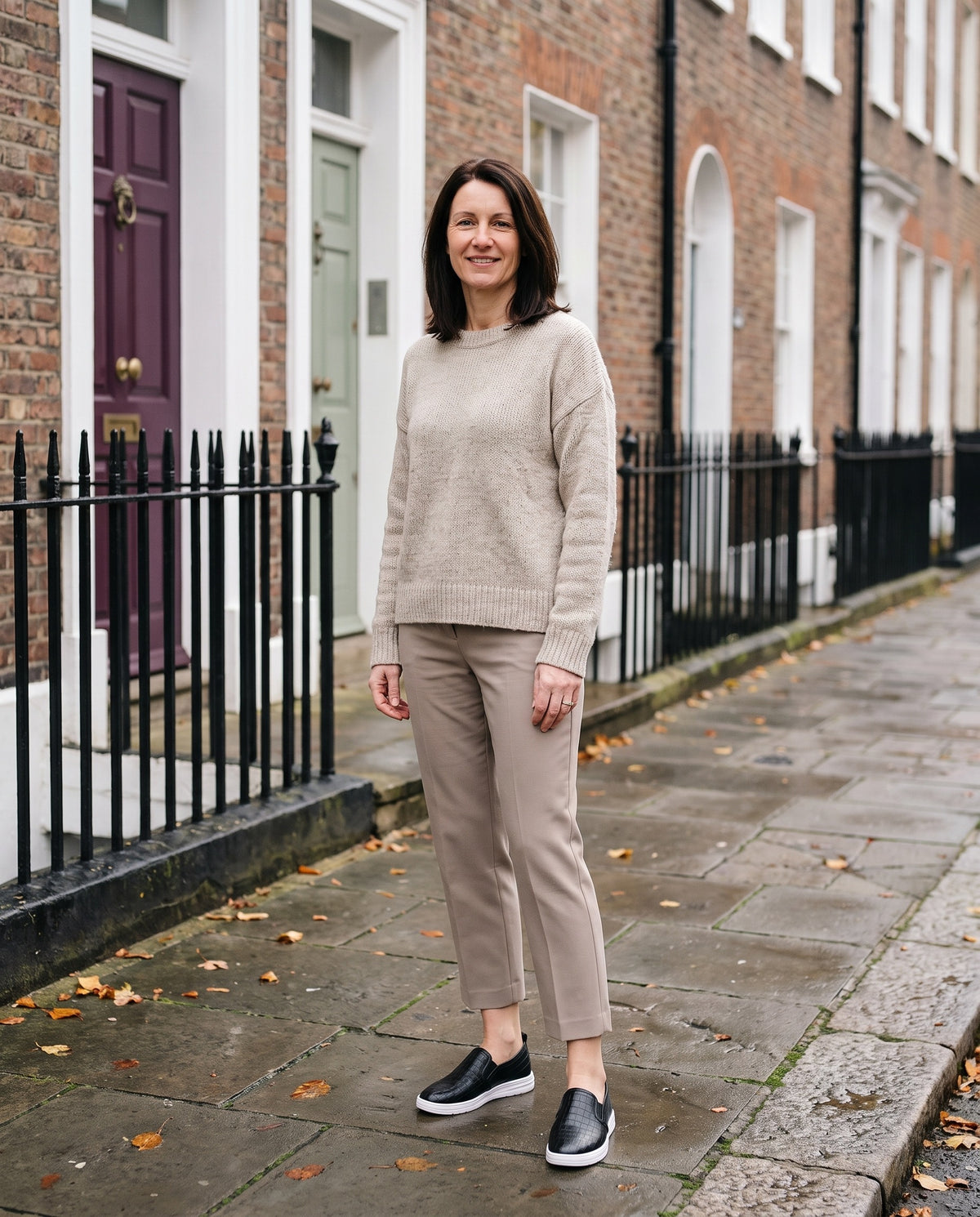 Woman wearing the supportive style loafers on an English residential street Image